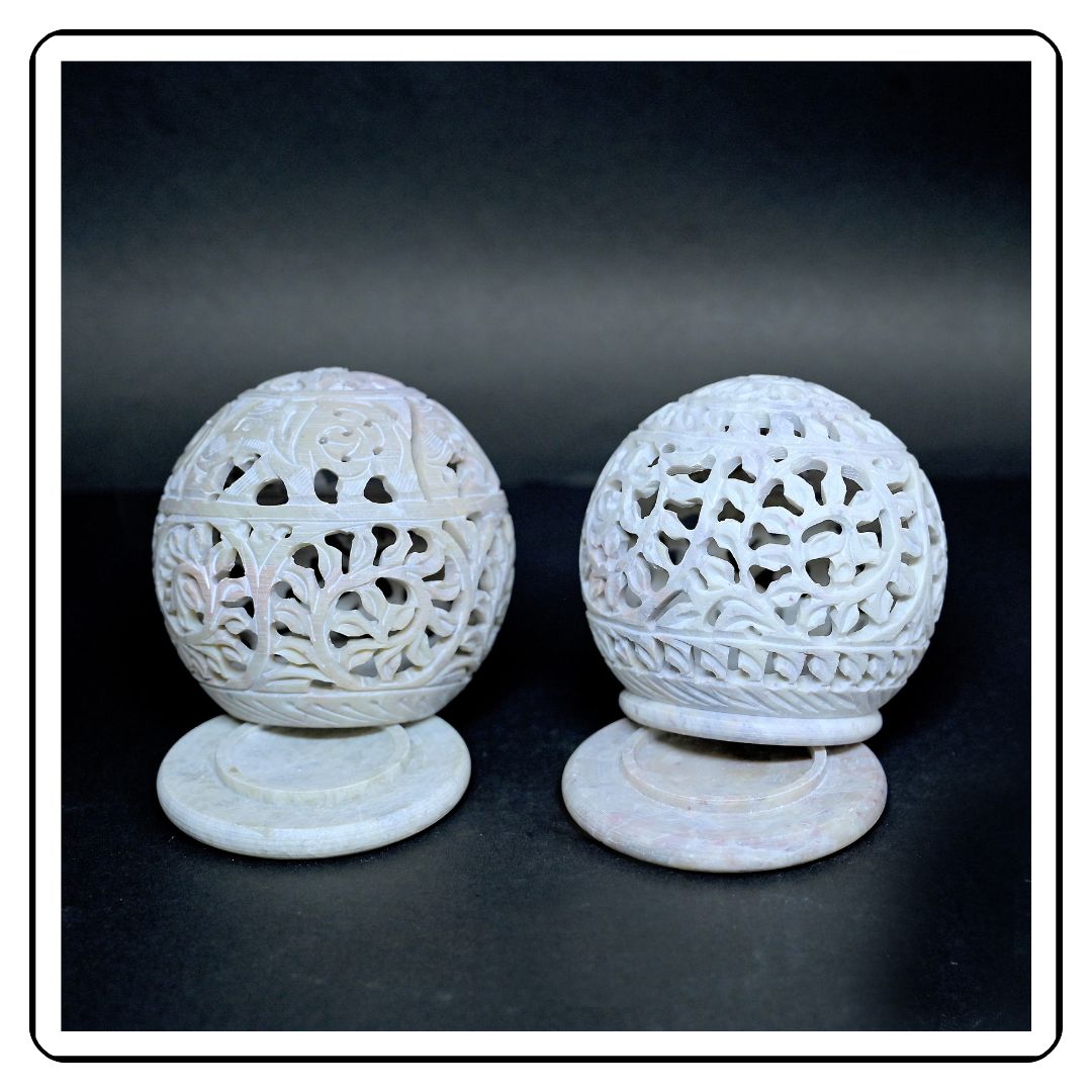 Intricate hand-carved jali soapstone candle holders, perfect for adding a cultural and artistic element to your decor."