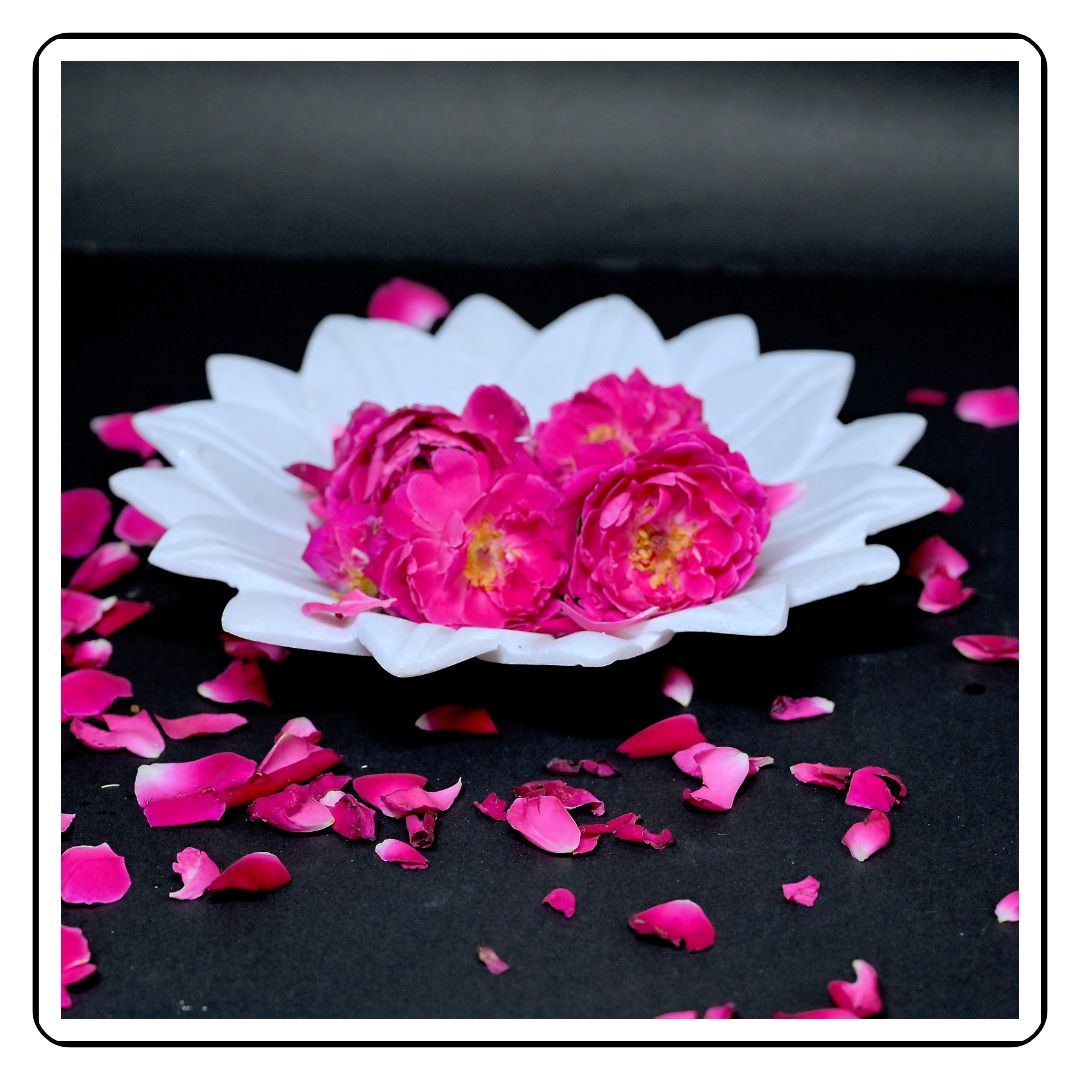 Sophisticated flower shape carved into a marble urli, ideal for use in spiritual or decorative displays."