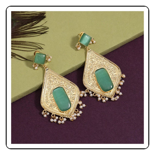 Close-up view of Elegant Rama Green Amrapali Earring featuring intricate gold detailing and vibrant green gemstones. The earrings have an elegant design with a polished finish